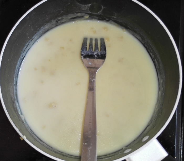 This is lumpy and watery.  Keep stirring out the lumps and don't add any more milk until this has started to thicken.