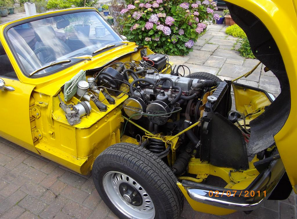 under the bonnet of the Triumph Spitfire to see engine